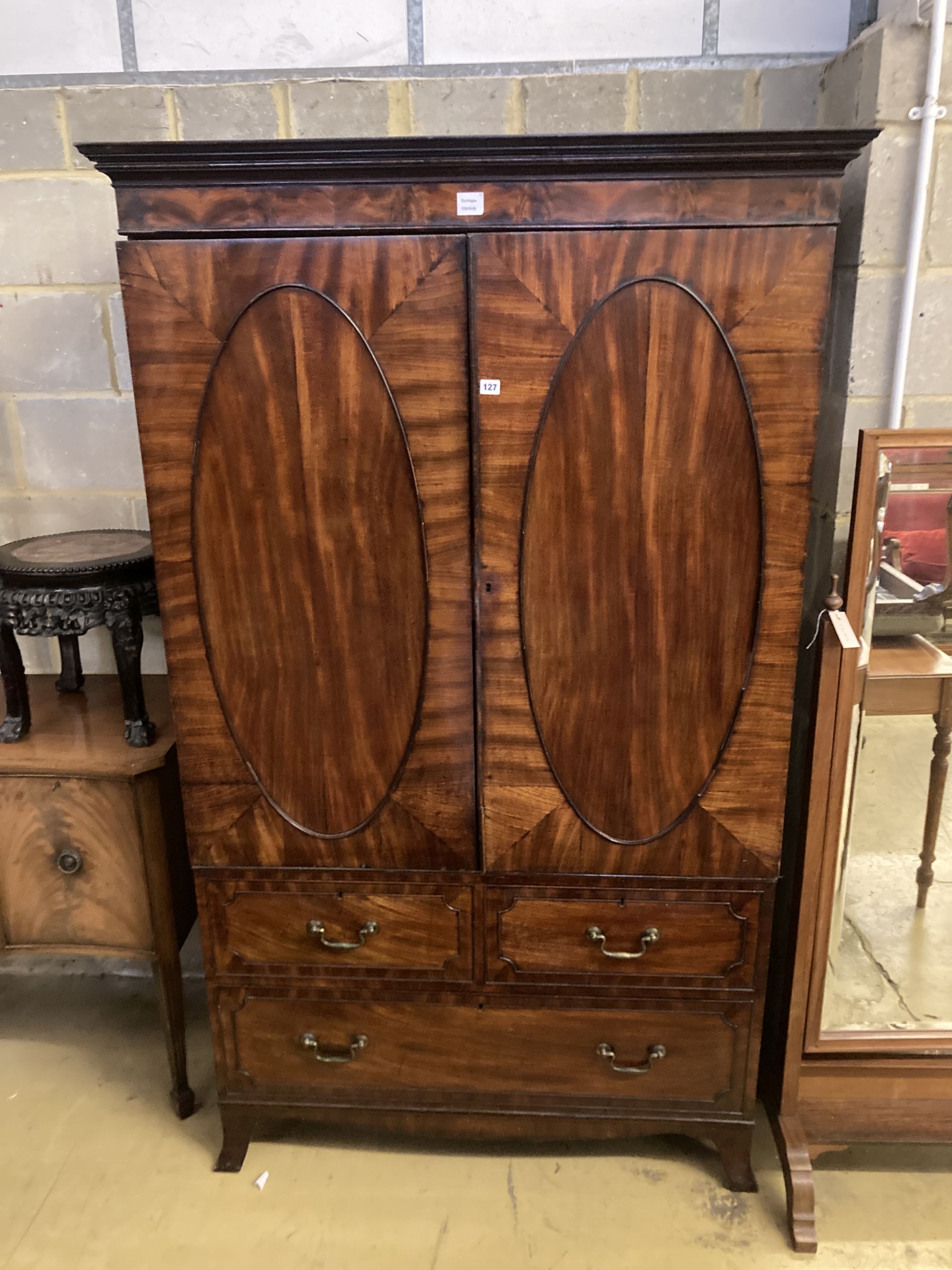 A George III mahogany linen press, width 120cm, depth 65cm, height 203cm